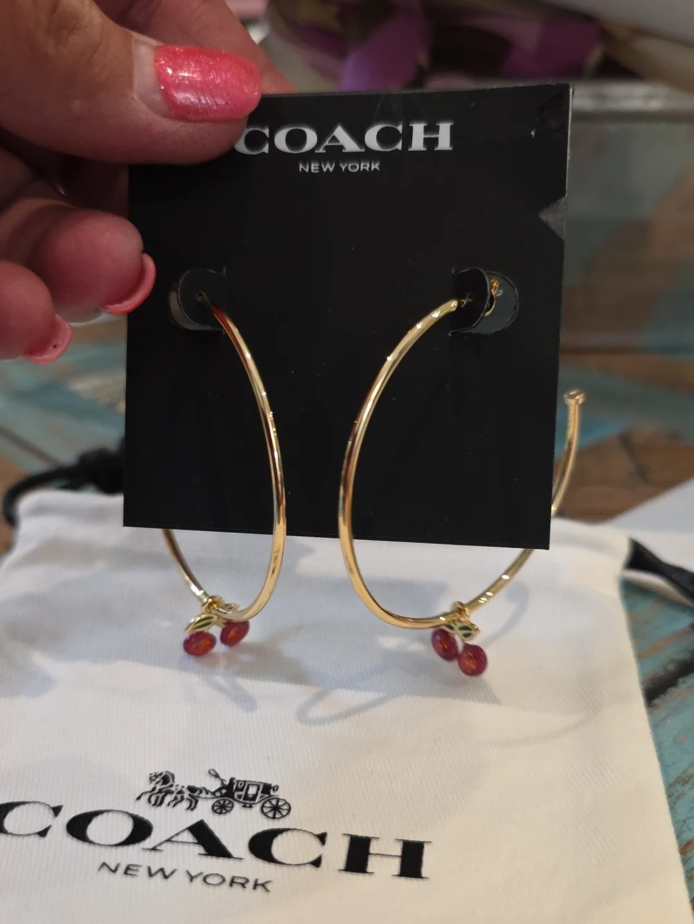 Coach gold tone